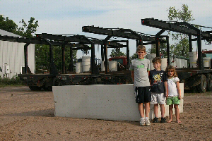 Children Next to a Stock Tank